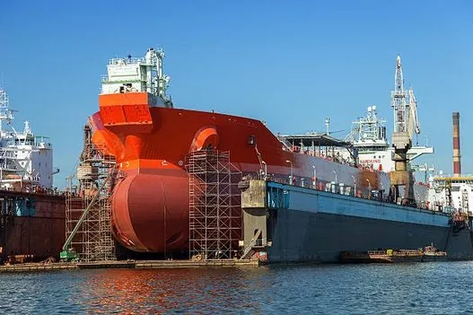 Red-hulled ship in dry dock – trusted partnership